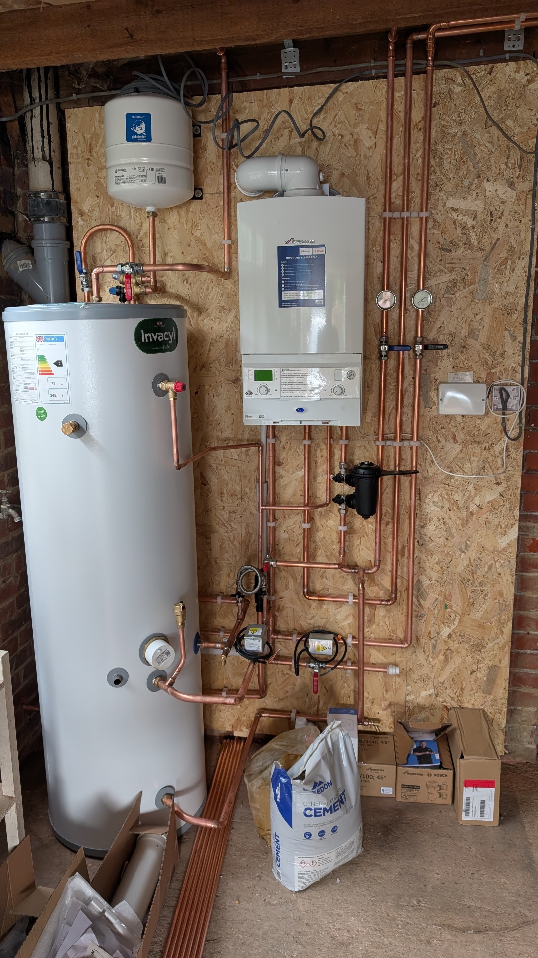 Full central heating plant room with pumps, manifolds and copper pipework